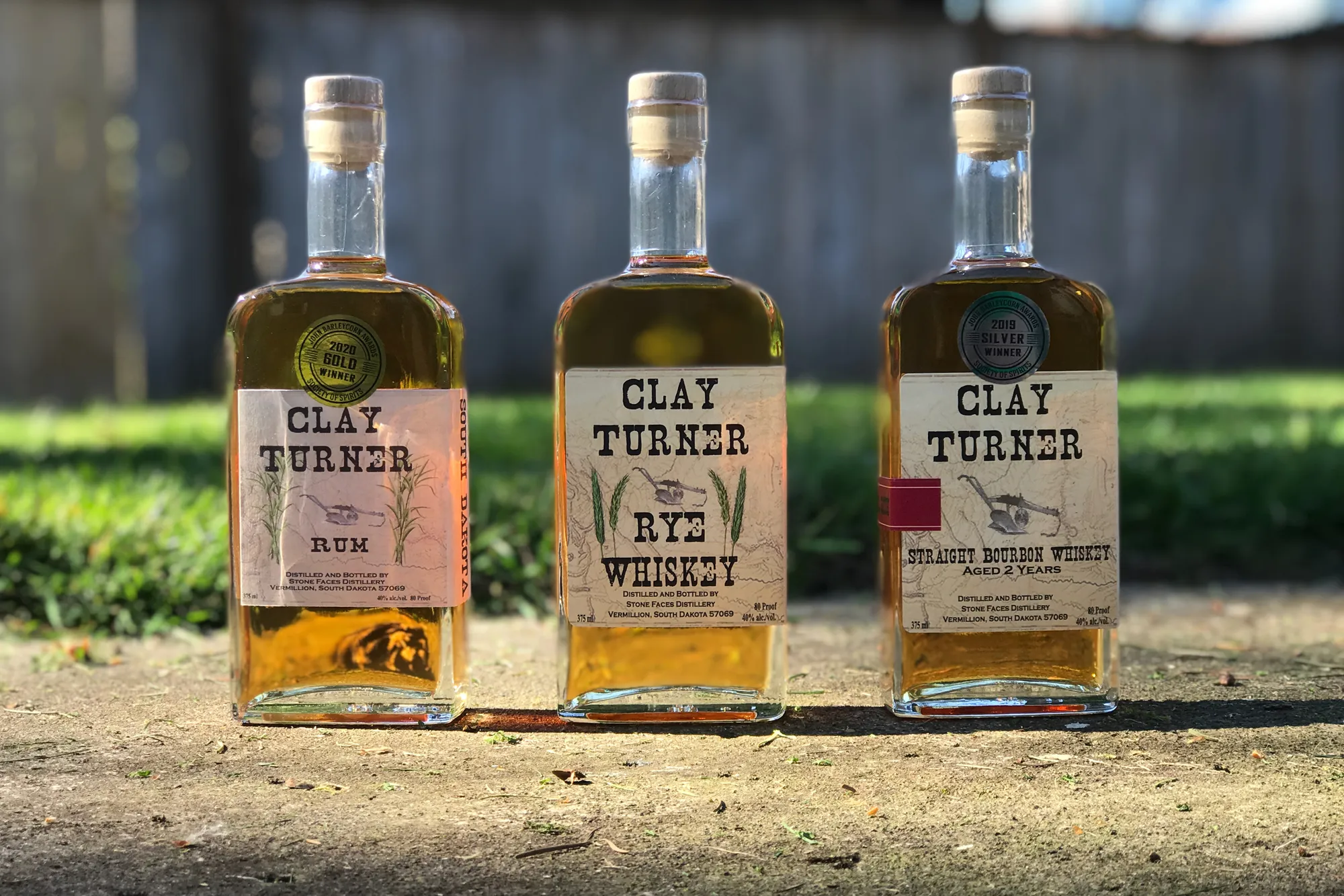 Clay Turner spirit bottles in sunlight