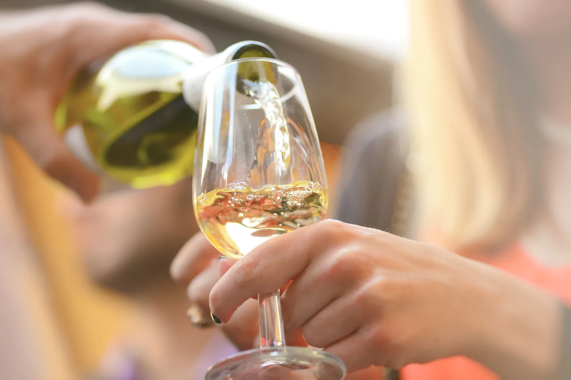 Wine being poured into a glass