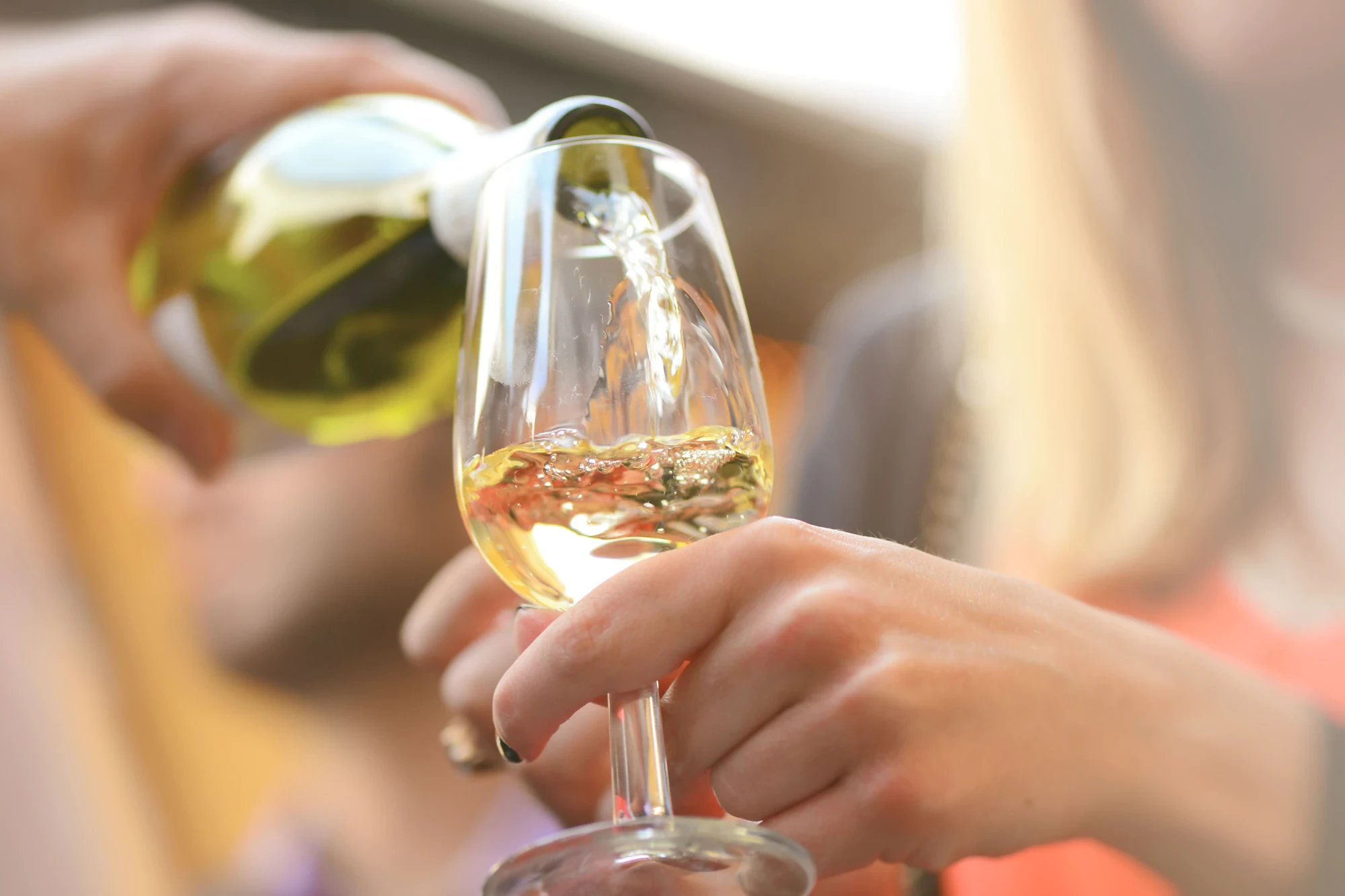 Wine being poured into glasses at Valiant Vineyards tasting room
